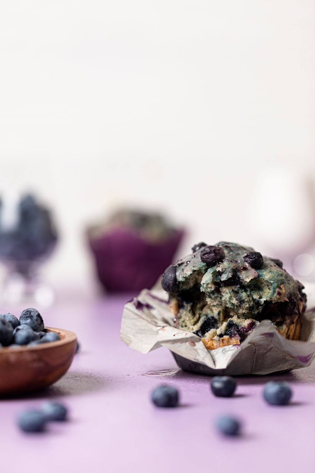 Vegan Roasted Blueberry Muffin with a bite missing