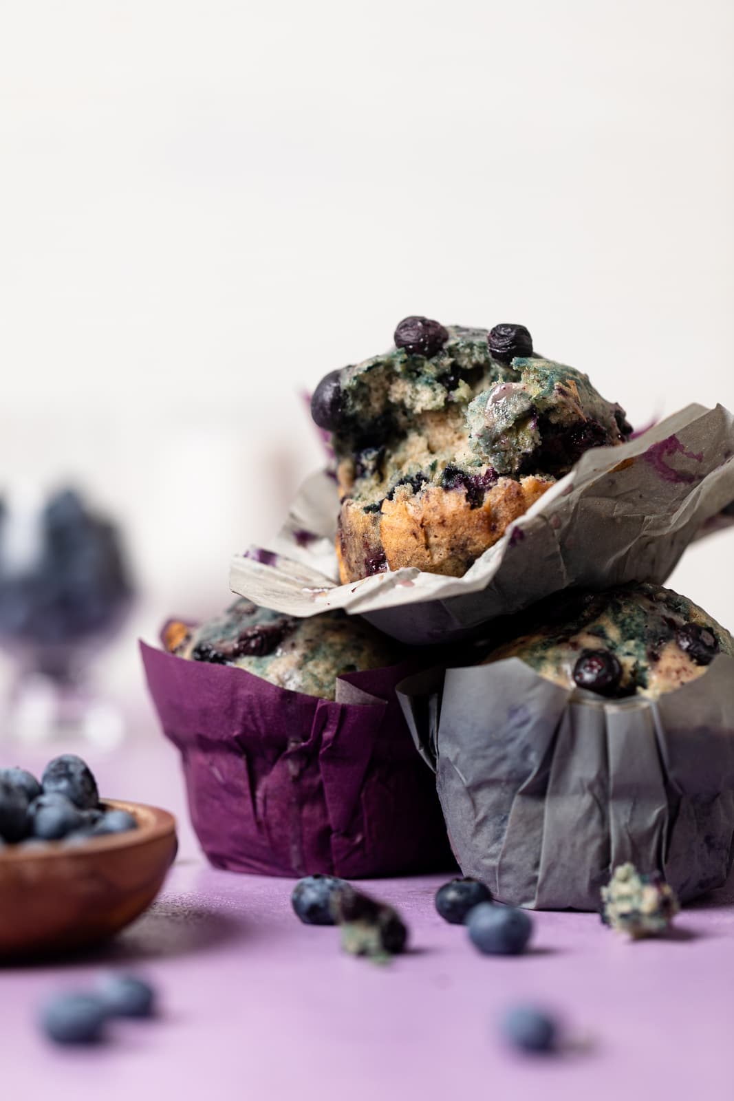 Pile of three Vegan Roasted Blueberry Muffins