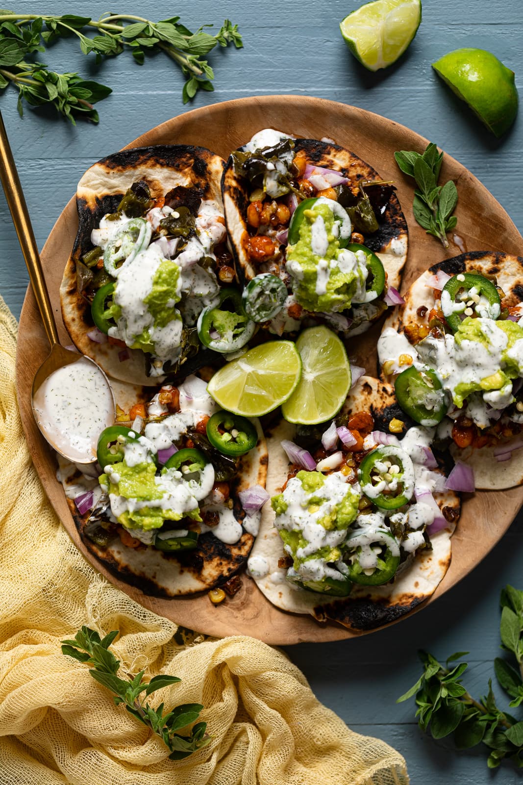 Plate of Best Summer Vegan Tacos with lime wedges and a spoon