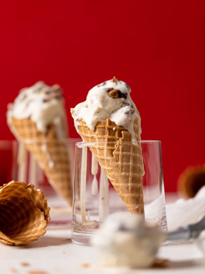 Two Maple Brown Butter Walnut Ice Creams in cones standing in glasses