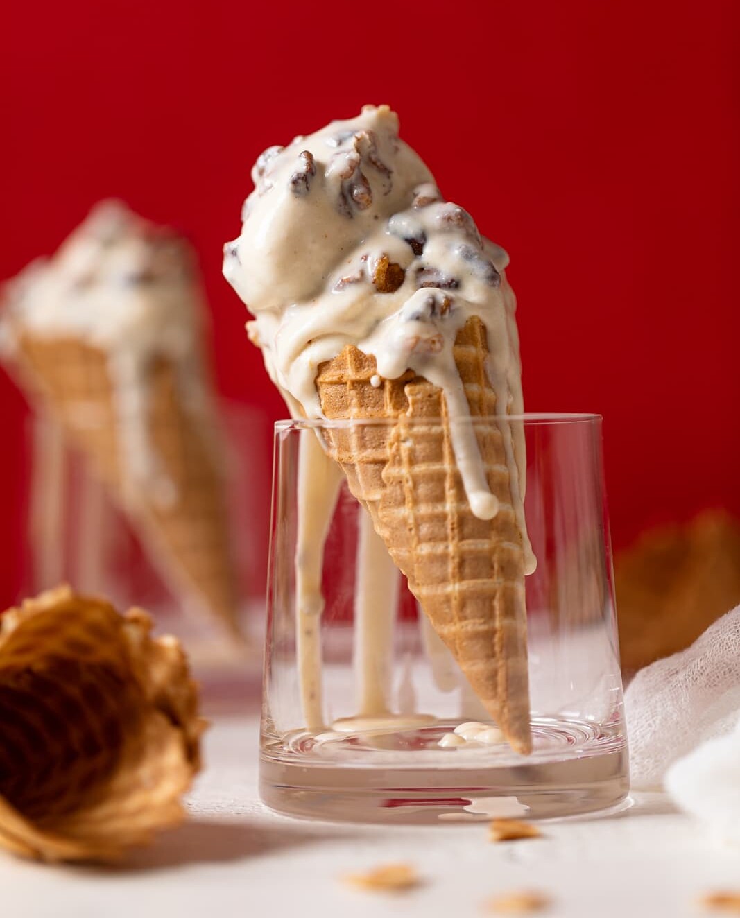 Maple Brown Butter Walnut Ice Cream melting down a cone standing in a glass