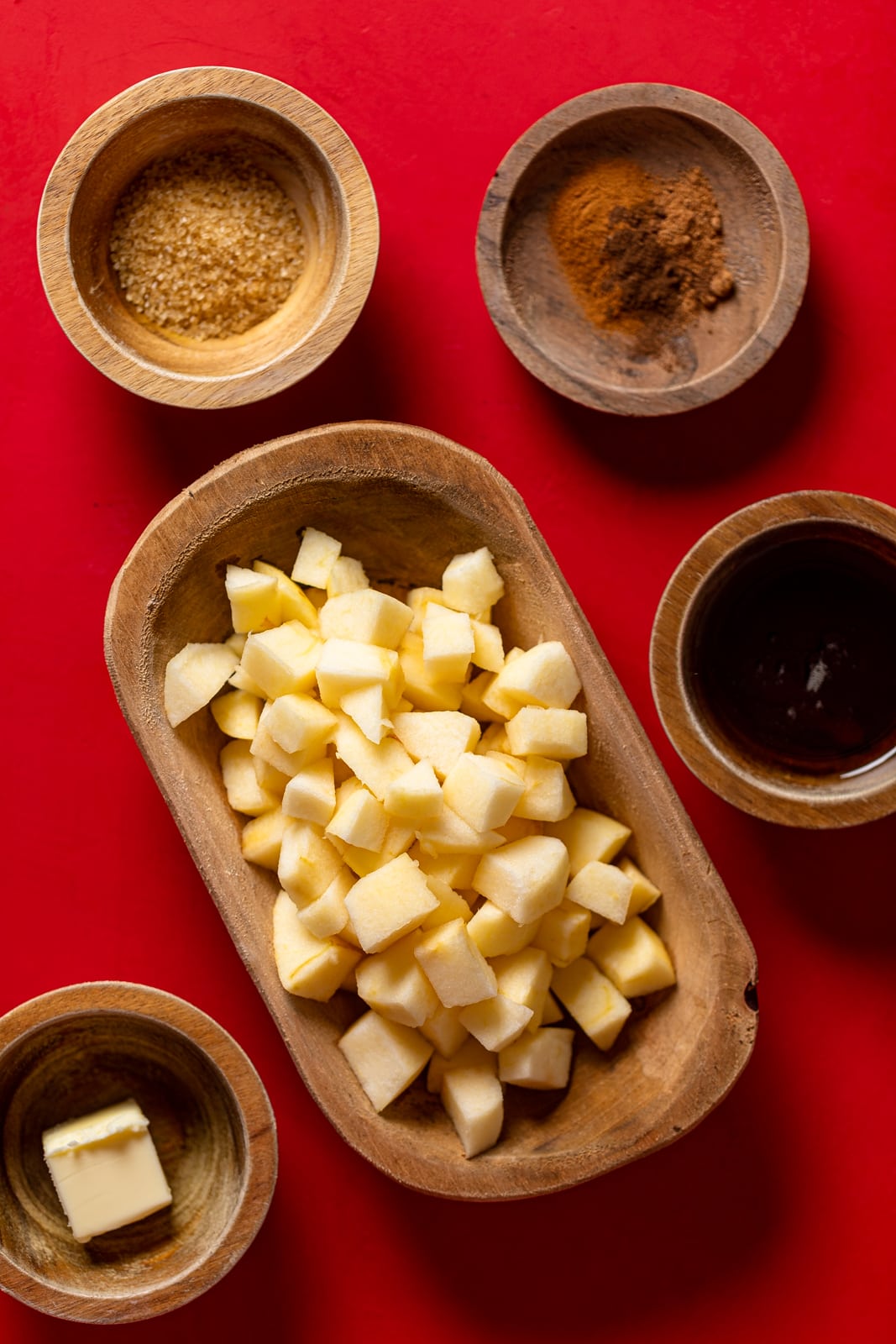 Ingredients for Apple Hand Pies including apple pieces, cinnamon, and butter