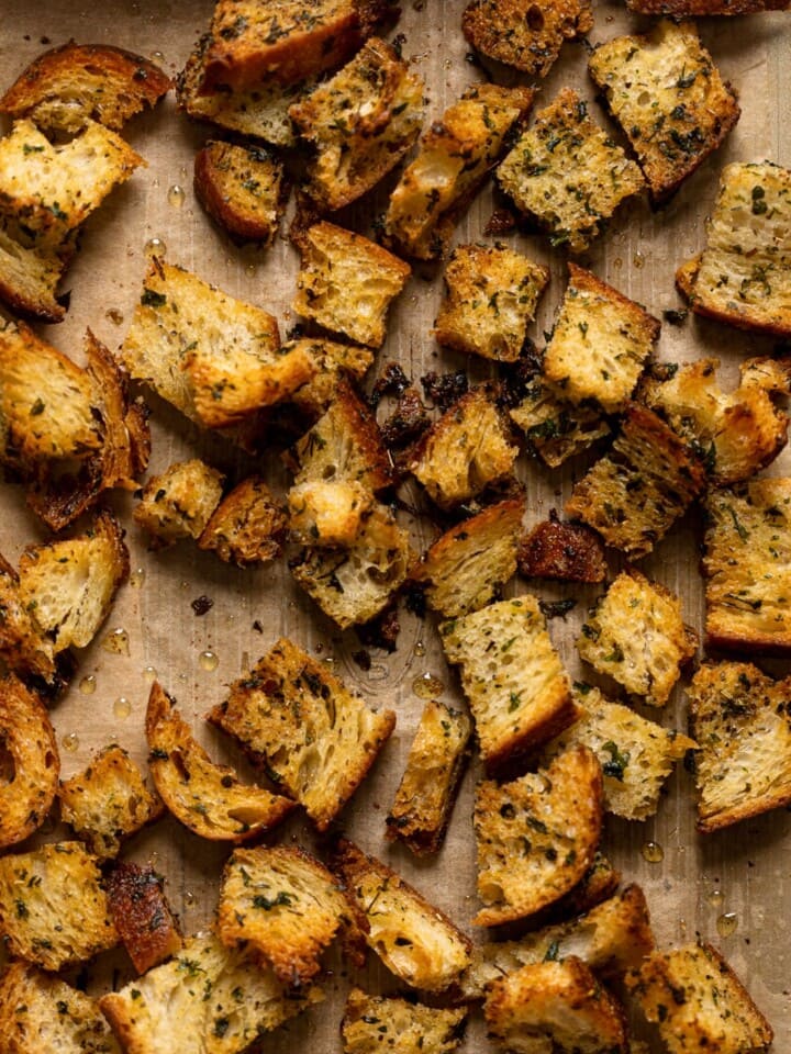 Homemade croutons on parchment paper
