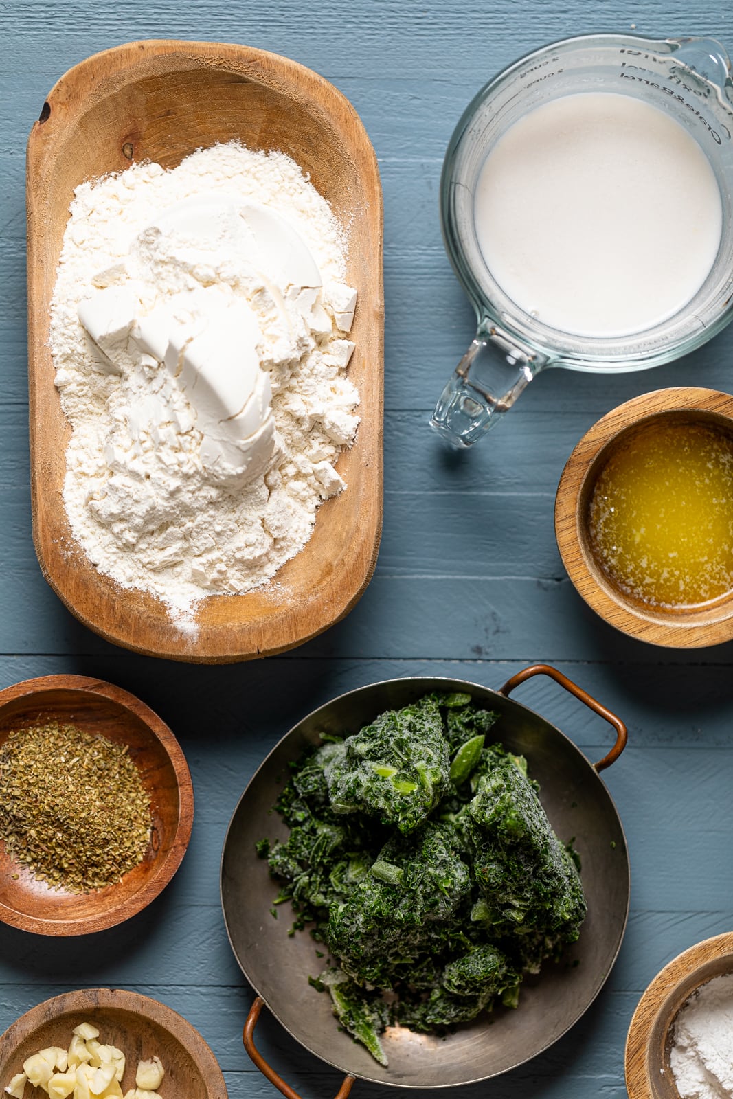 Ingredients for Vegan Garlic Herb Kale Bread including frozen kale, flour, and almond milk