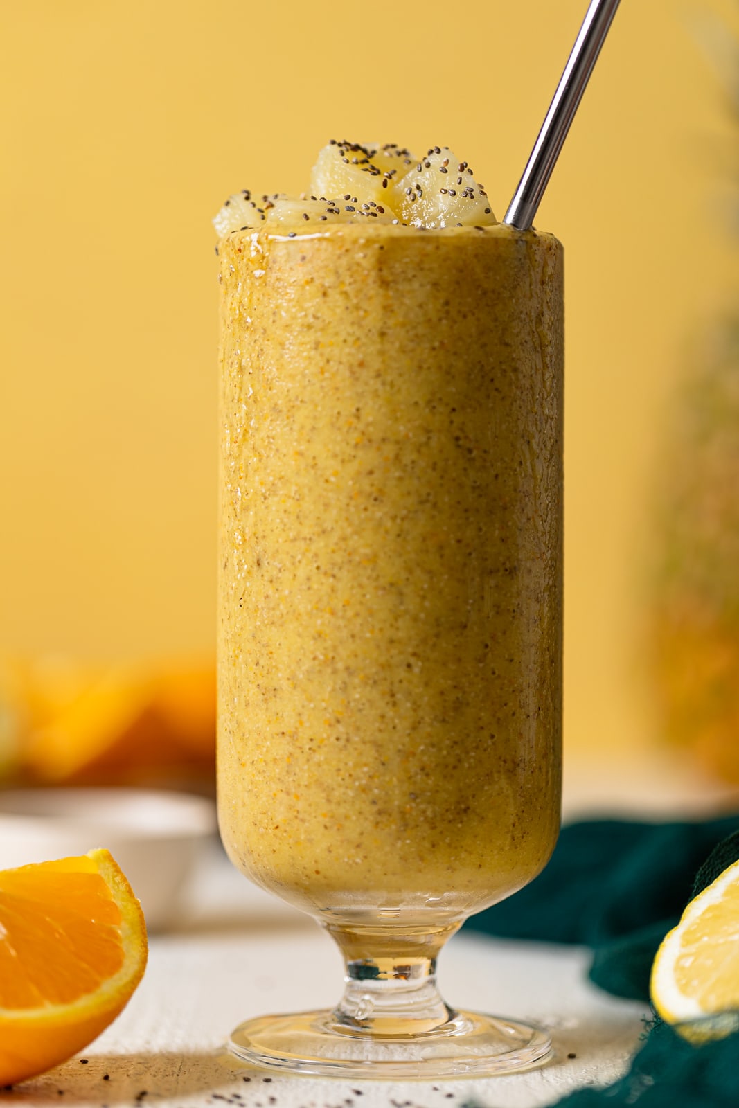 Closeup of a Pineapple Citrus Smoothie with a straw