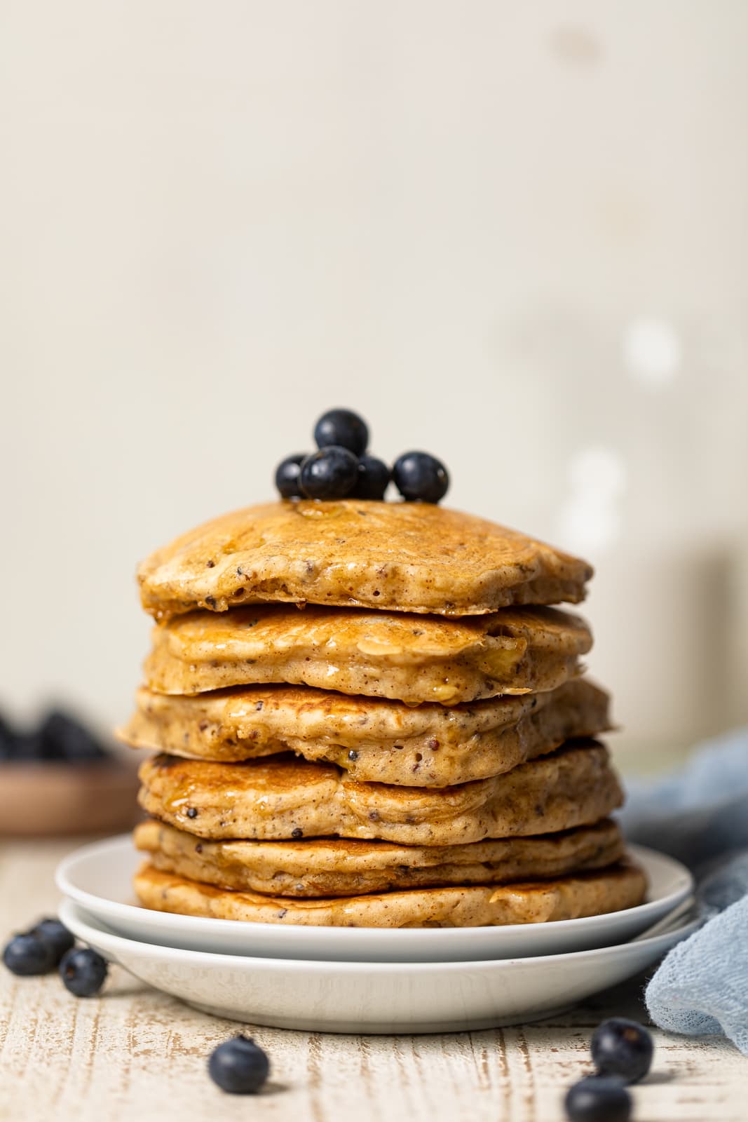Stack of Fluffy Protein Pancakes topped with blueberries