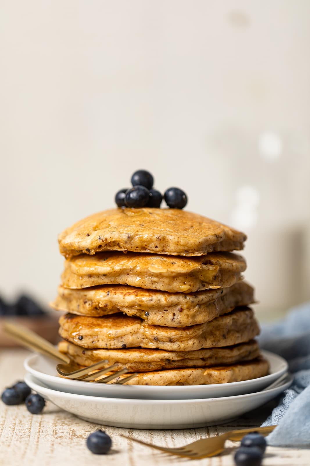 Stack of Fluffy Protein Pancakes topped with blueberries