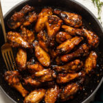 Skillet of Spicy Peach Chicken Wings