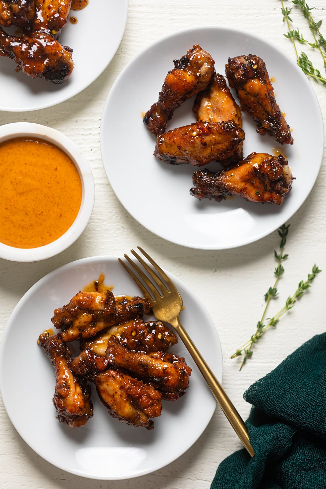 Two plates of Sticky Peach Chicken Wings