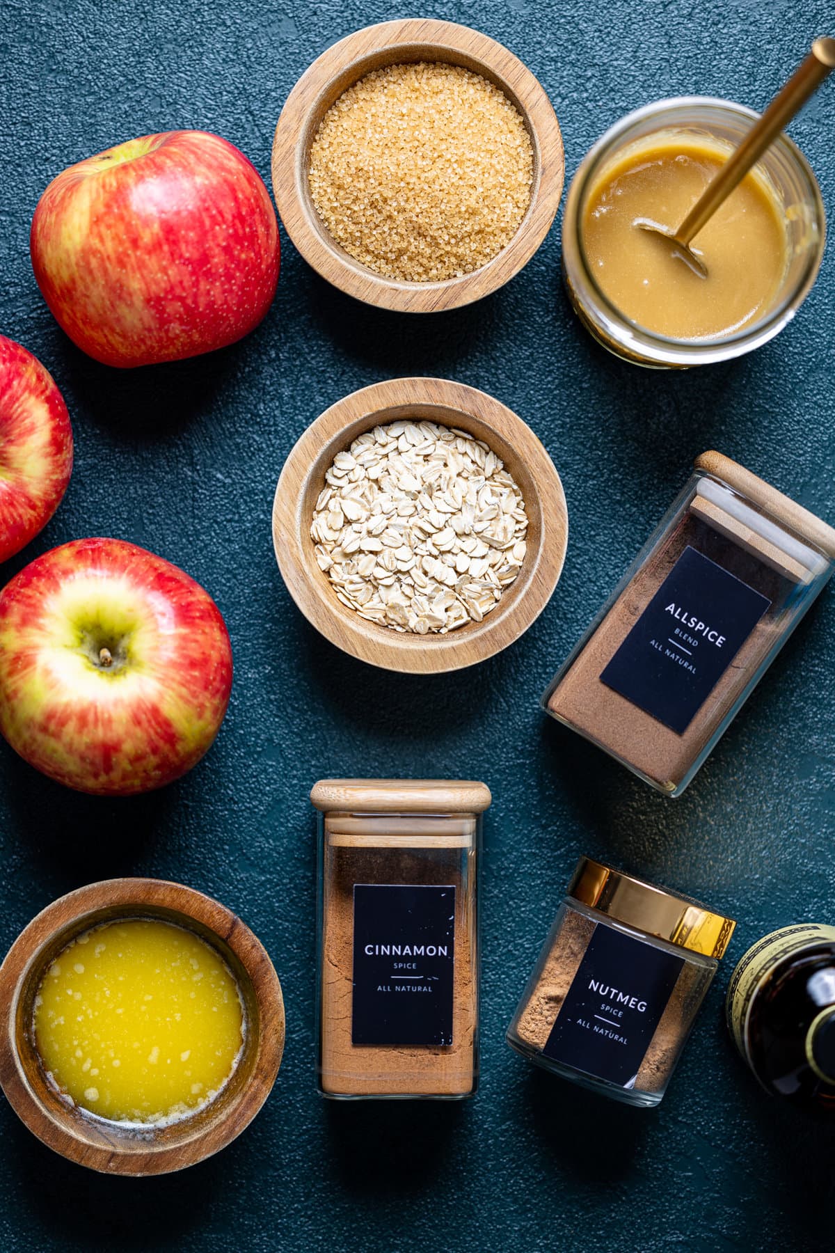 Ingredients for Salted Caramel Apple Crisp including oats, allspice, and nutmeg