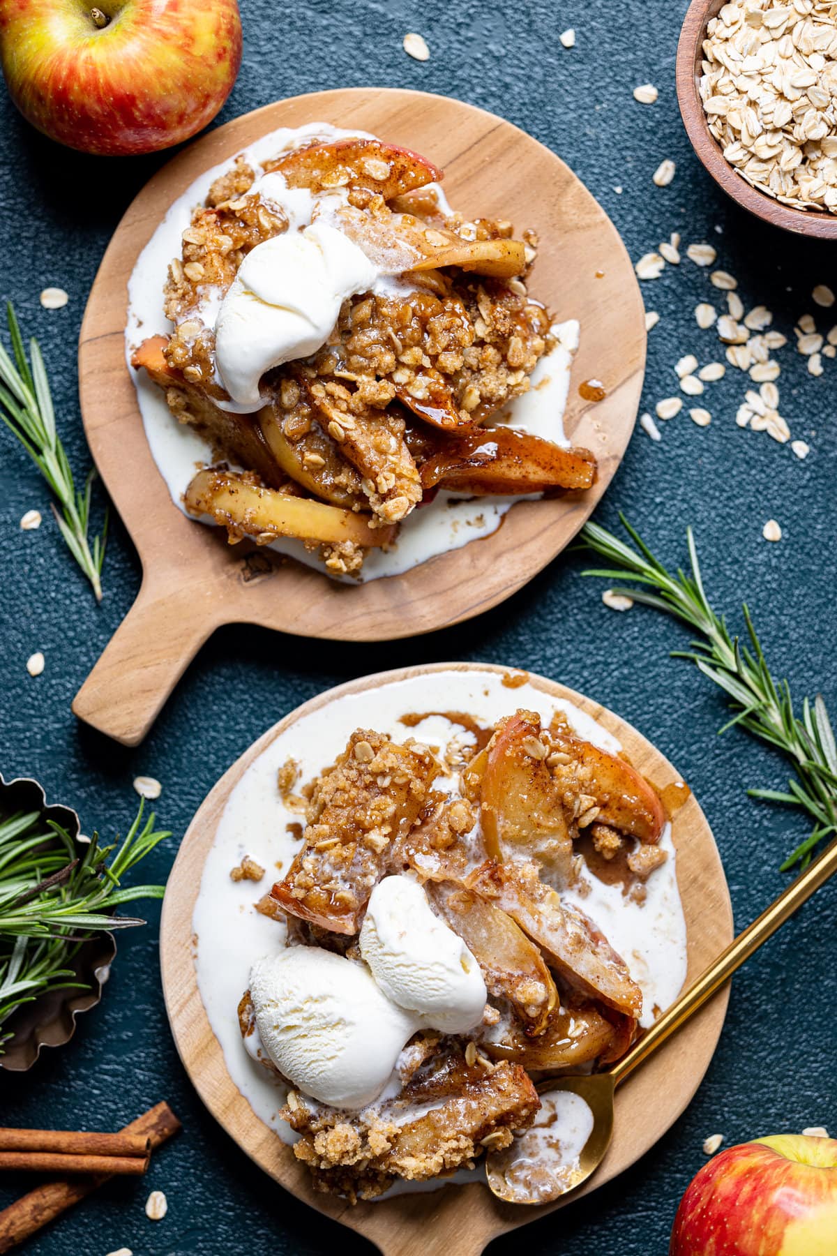 Overhead shot of two plates of Salted Caramel Apple Crisp