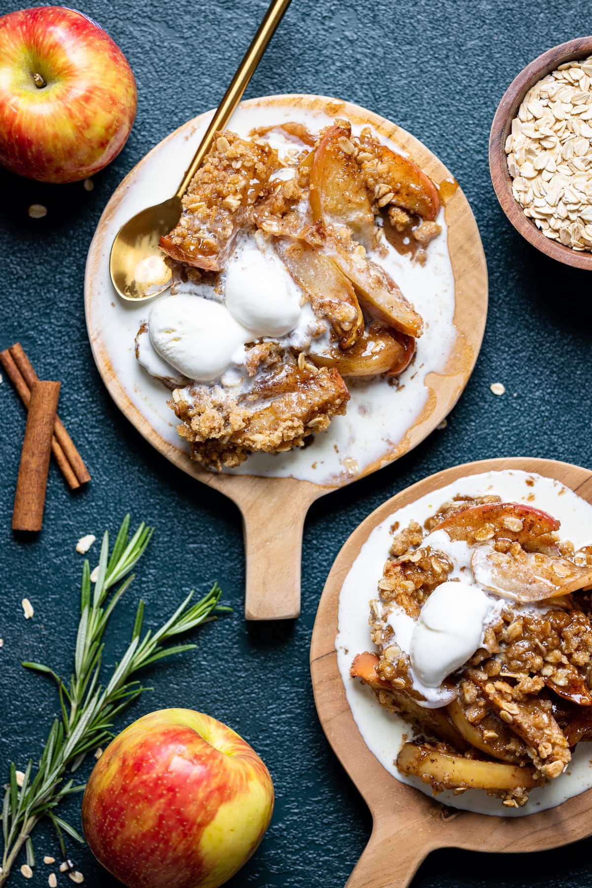 Overhead shot of two plates of Salted Caramel Apple Crisp