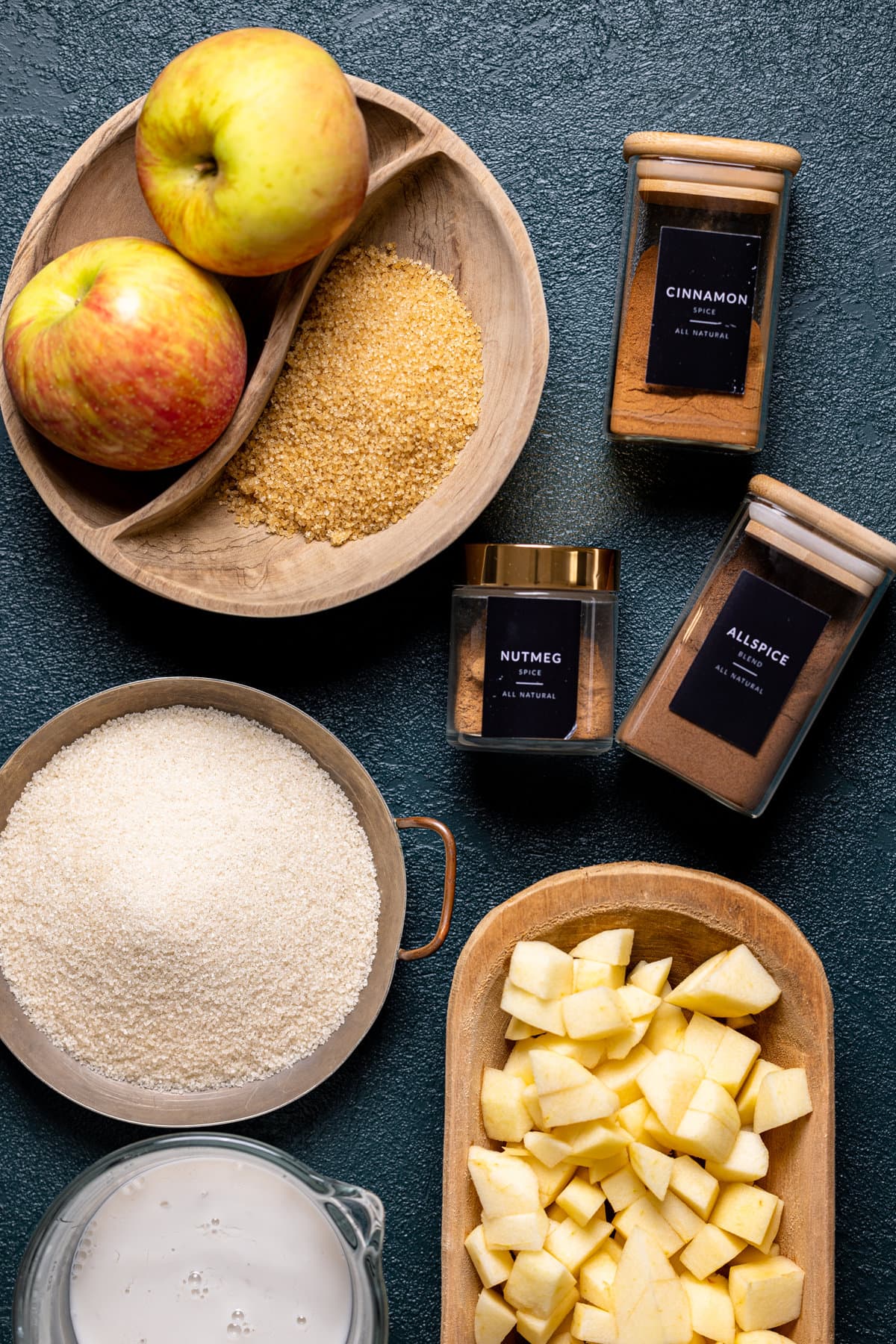 Ingredients for Apple Cinnamon Olive Oil Cake including apples, nutmeg, and allspice