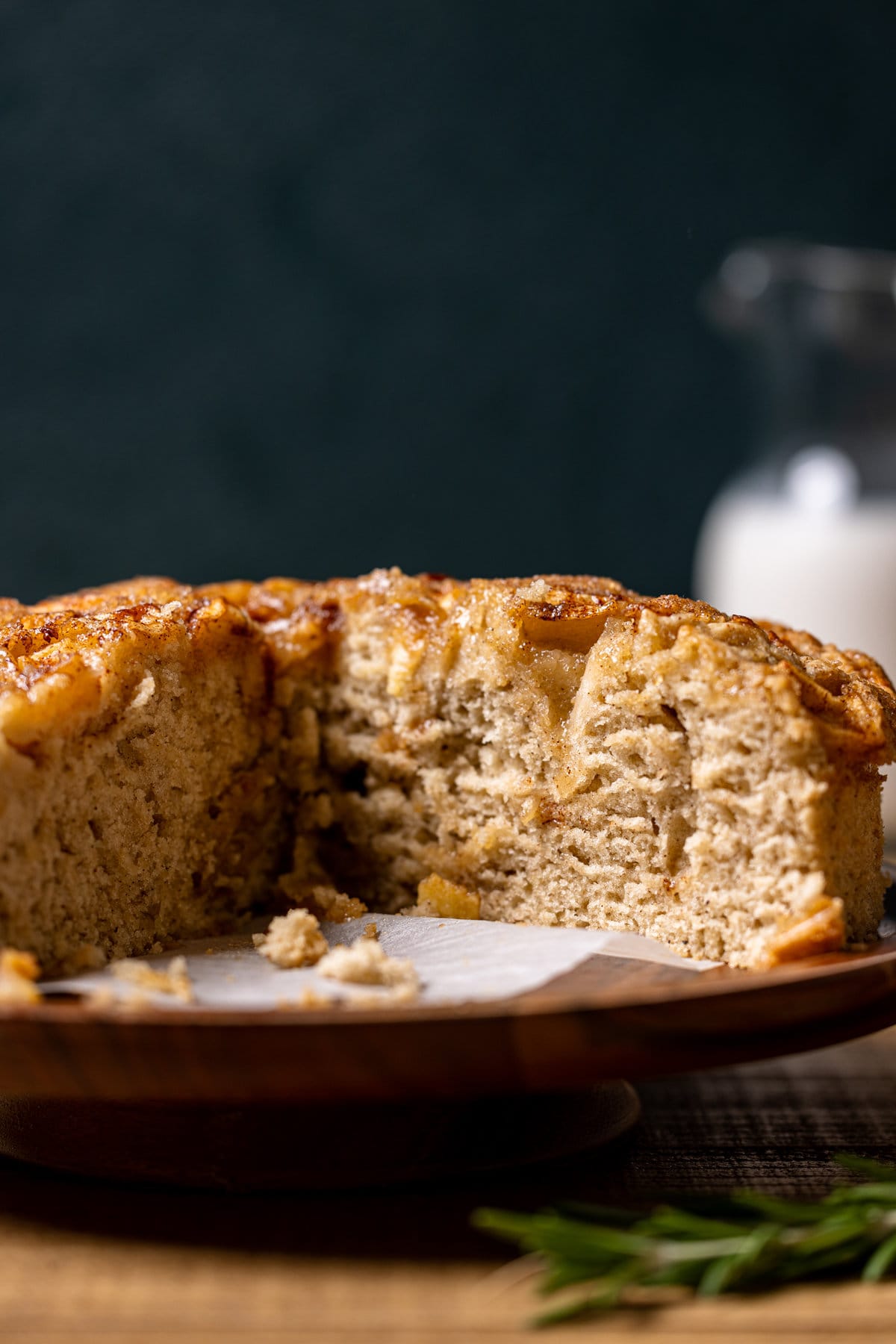 Close of an Apple Cinnamon Olive Oil Cake missing a slice