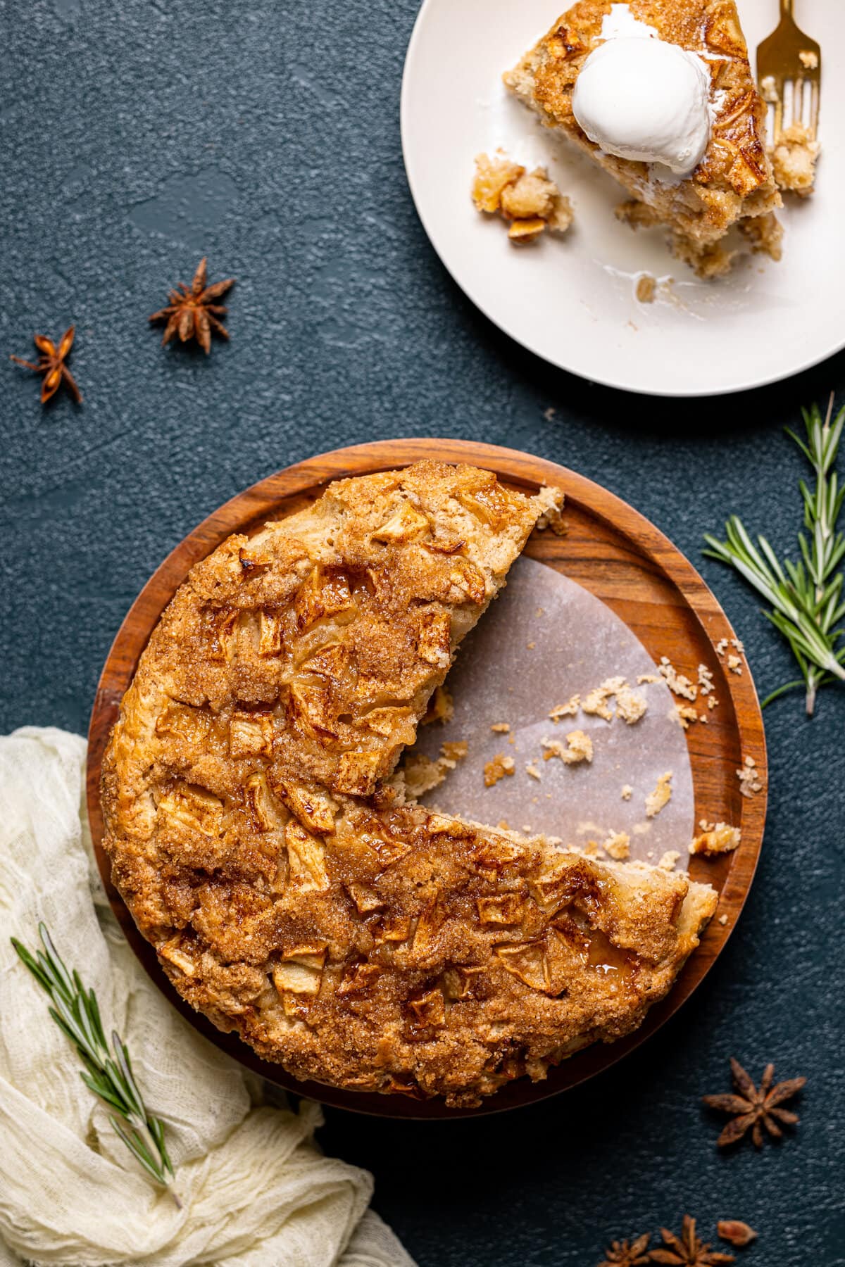 Overhead shot of an Apple Cinnamon Olive Oil Cake missing two pieces