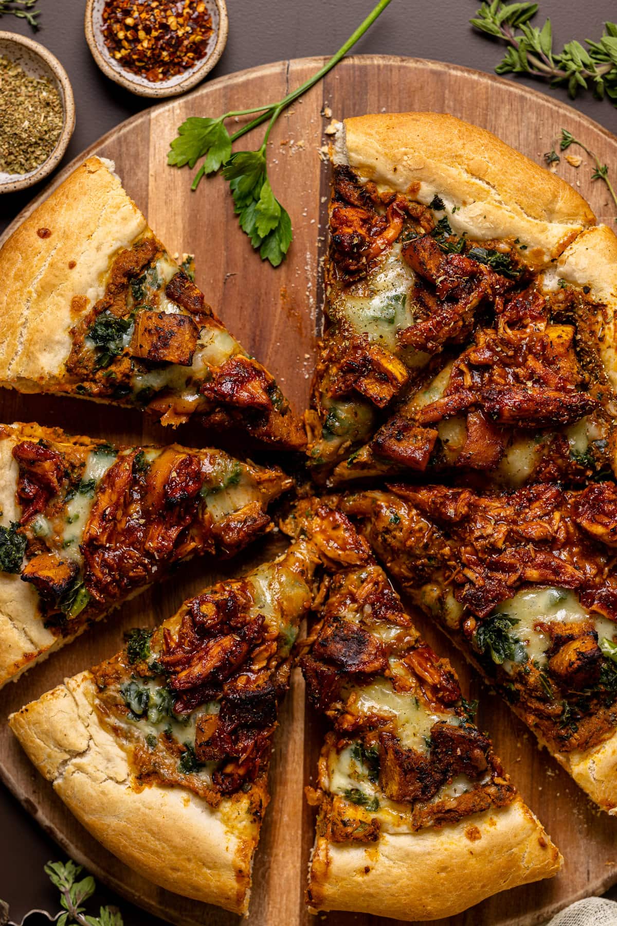 Closeup of a sliced Pumpkin BBQ Chicken Pizza with Butternut Squash