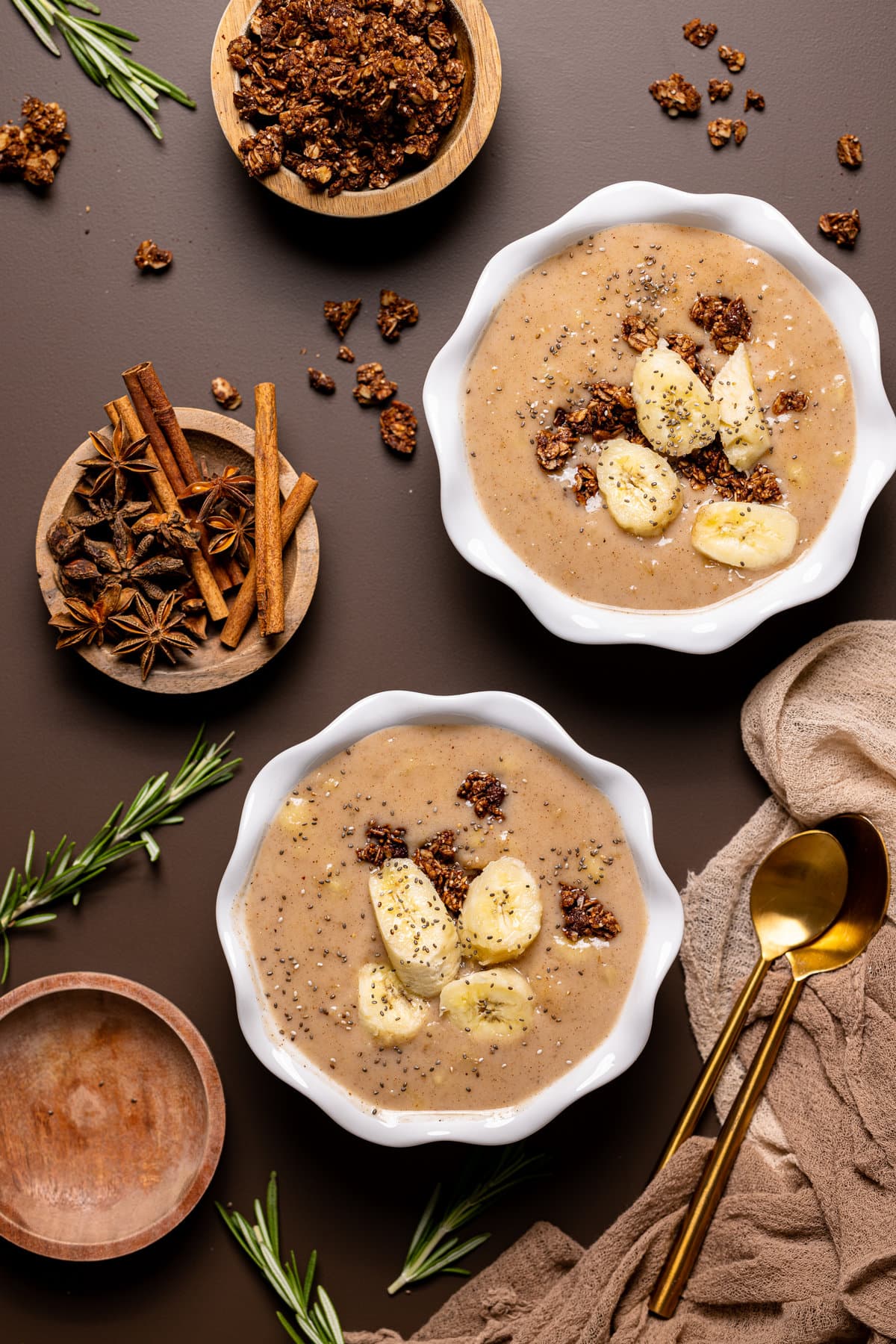 Overhead shot of two bowls of Banana Chai Oatmeal Porridge