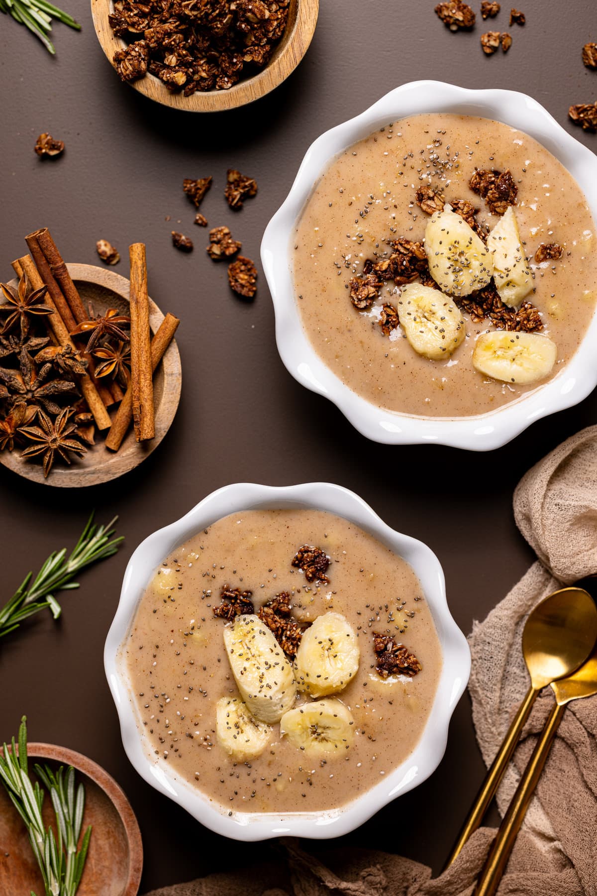 Overhead shot of two bowls of Banana Chai Oatmeal Porridge
