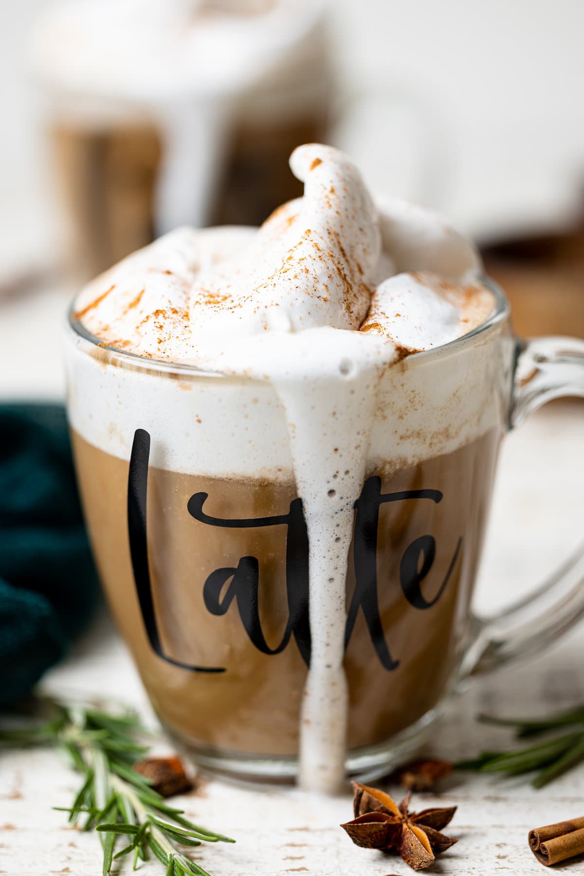 Closeup of an overflowing glass of Fall Spice Latte