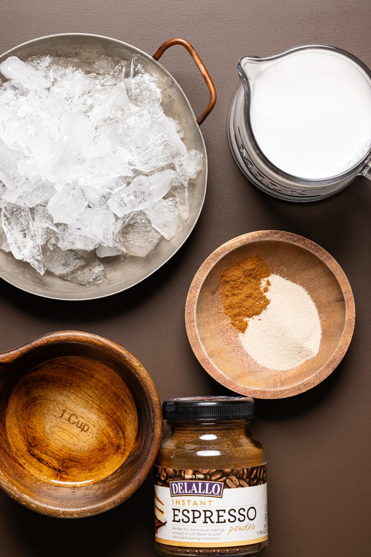 Ingredients on a dark brown table.