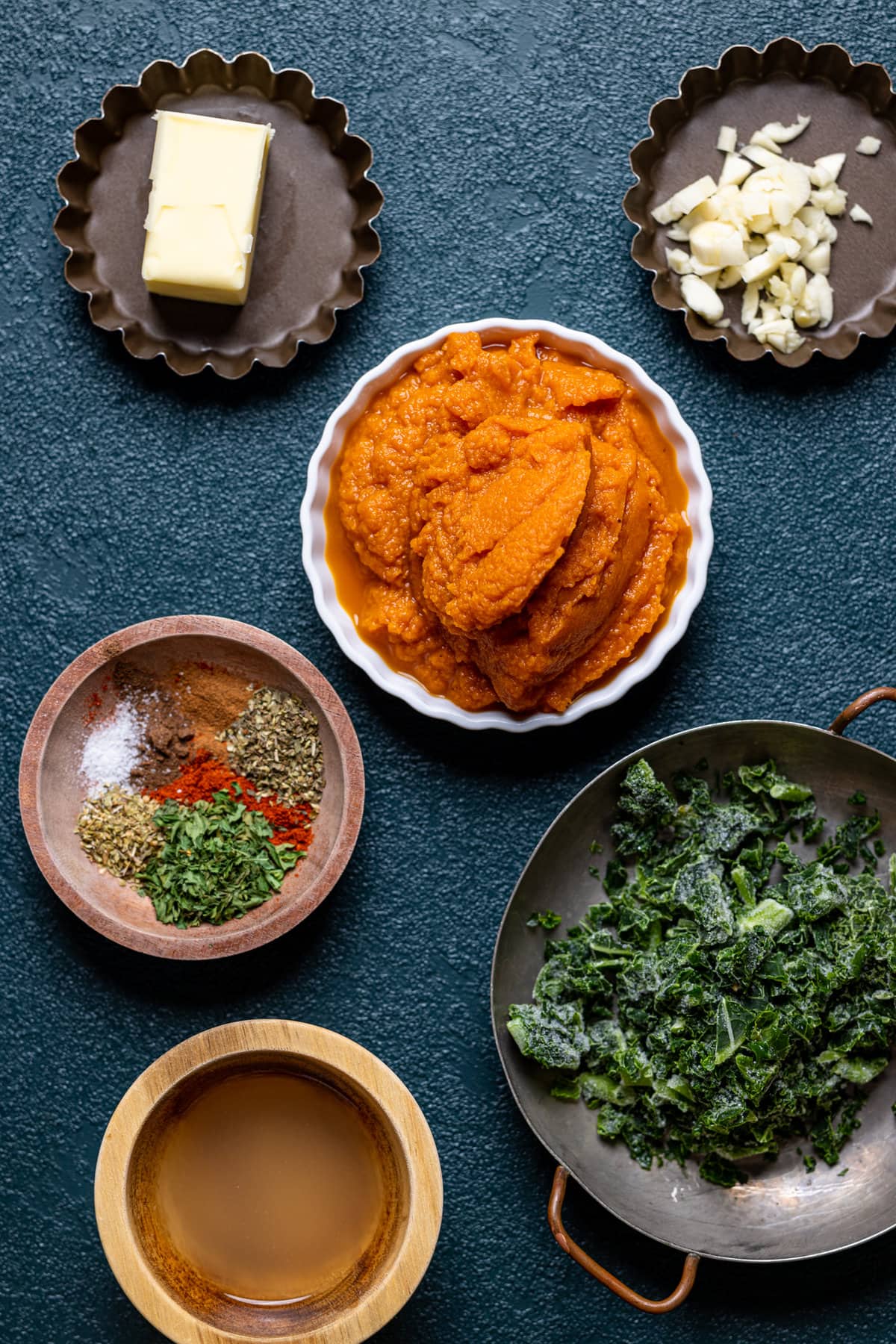 Ingredients for Spicy Brown Butter Pumpkin Rigatoni including garlic, seasonings, and pumpkin puree