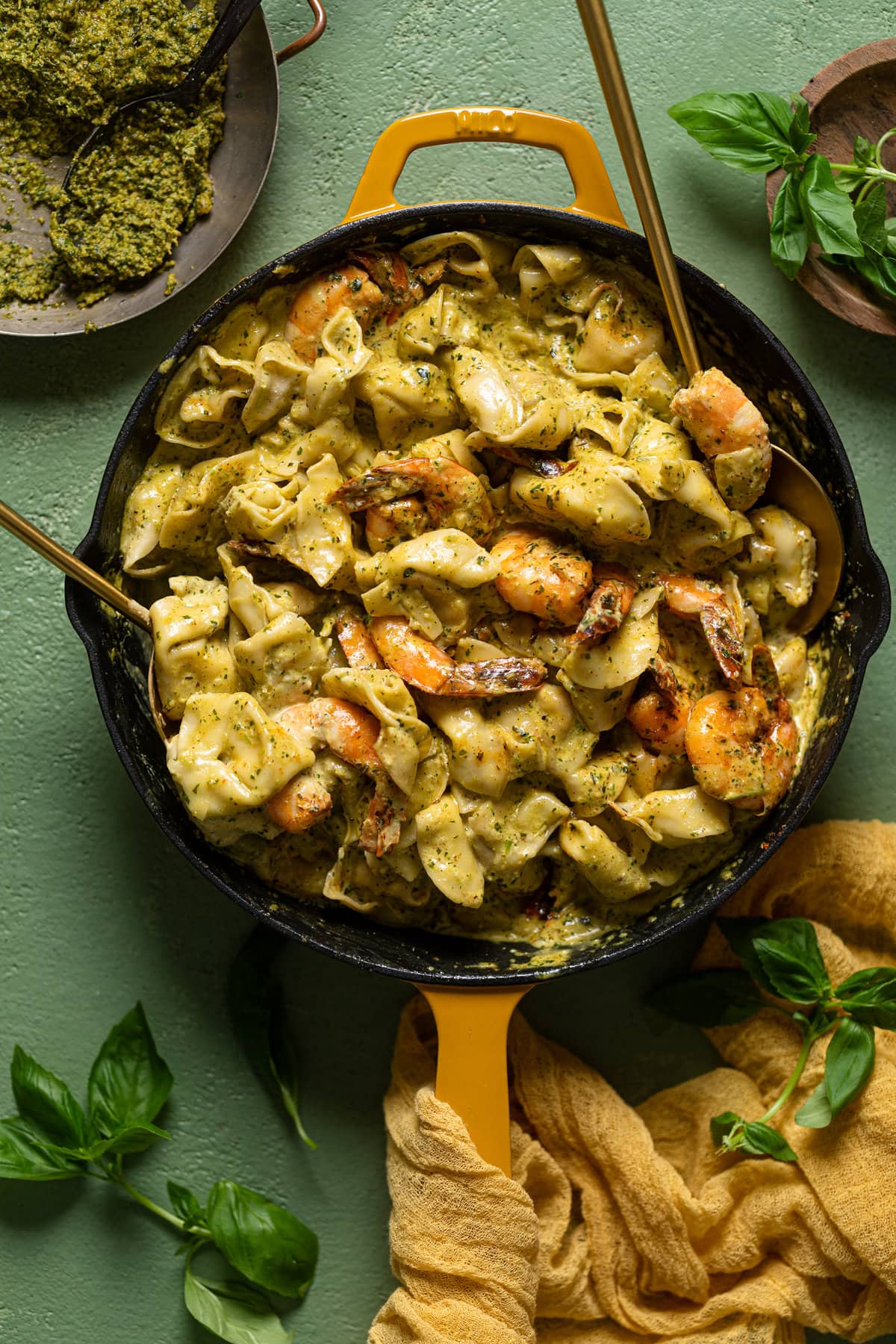 Overhead shot of a skillet of Creamy Shrimp Pesto Tortellini Pasta