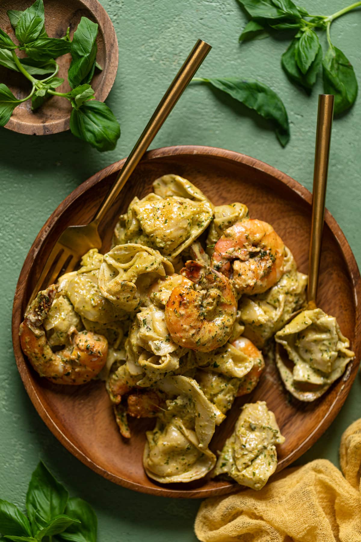 Creamy Shrimp Pesto Tortellini Pasta on a wooden plate