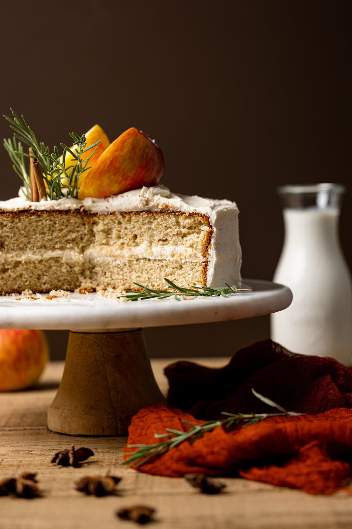 Apple Cider Cake with Cinnamon Maple Buttercream missing a slice