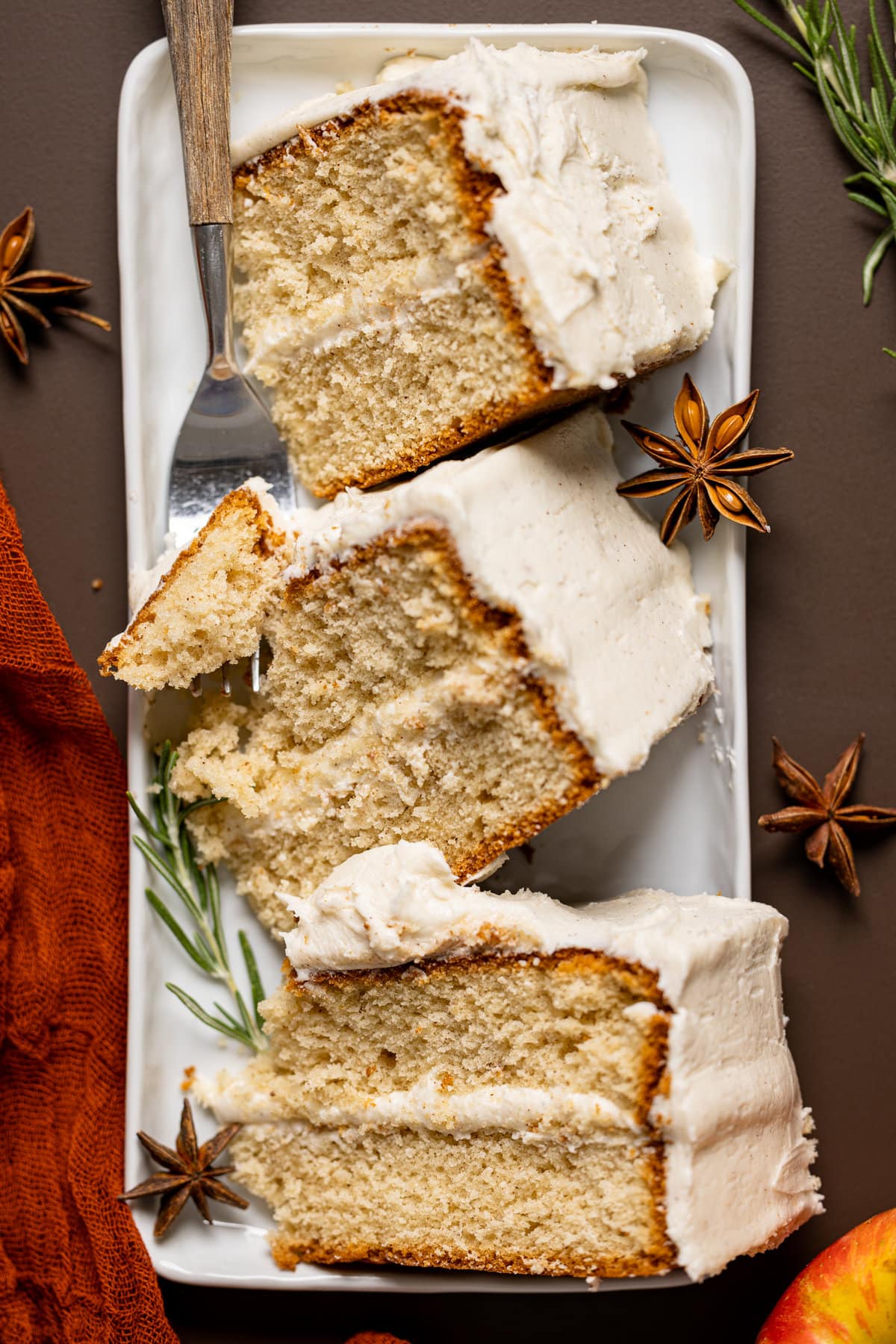 Overhead shot of slices of Apple Cider Cake with Cinnamon Maple Buttercream