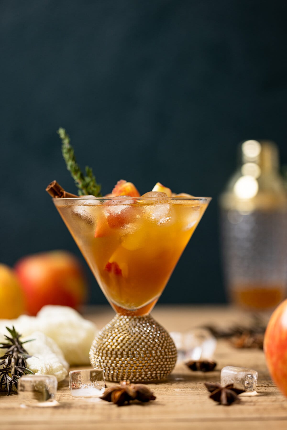 Closeup of an Apple Cider Mocktail in a jeweled cocktail glass