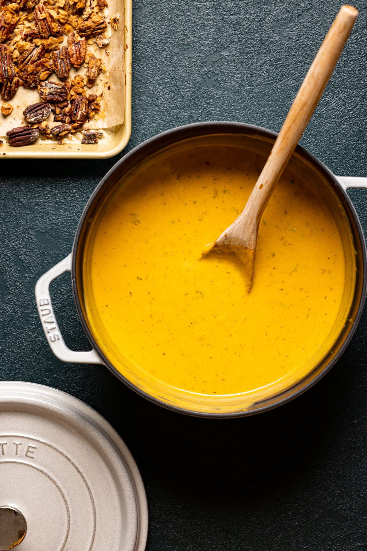 Dutch oven full of Apple Cheddar Sweet Potato Soup