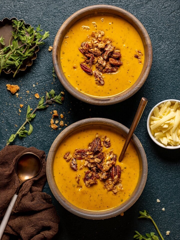 Two bowls of Apple Cheddar Sweet Potato Soup