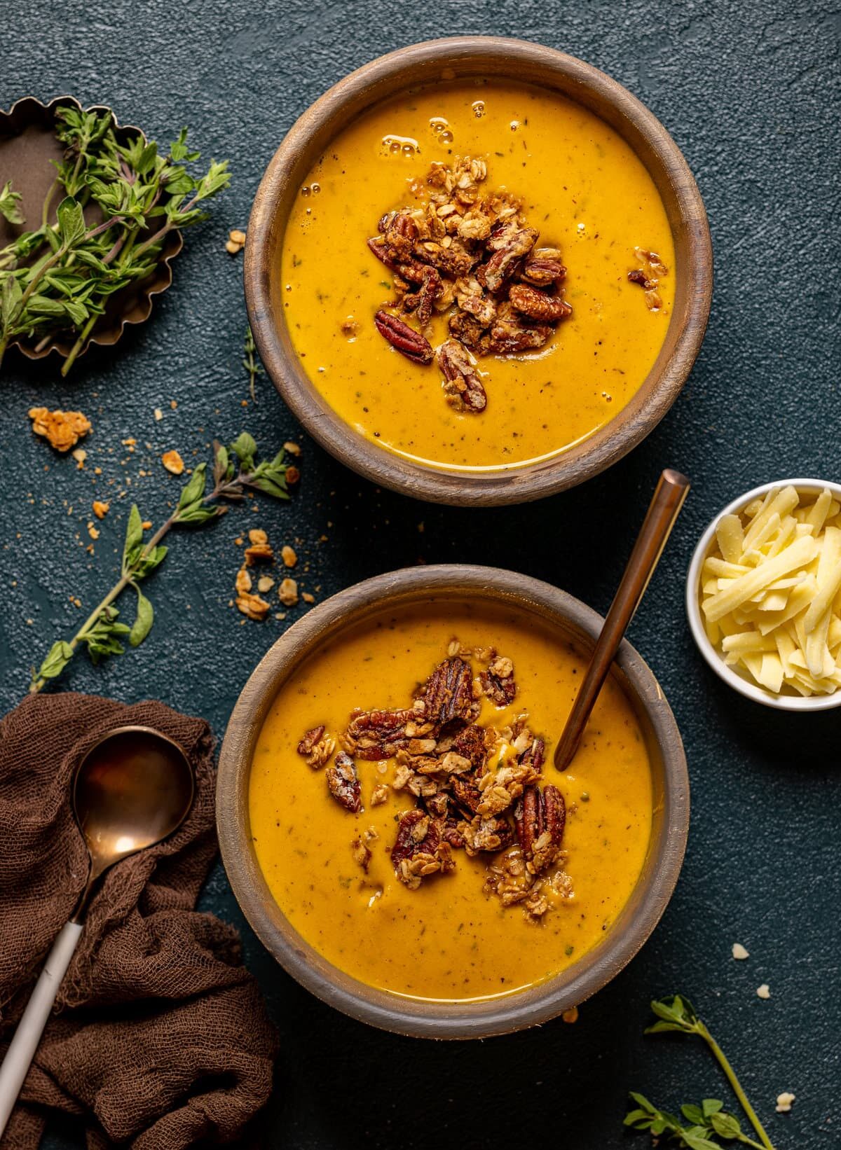 Two bowls of Apple Cheddar Sweet Potato Soup