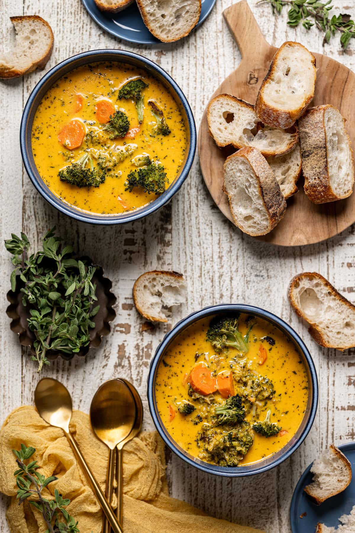 Overhead shot of two bowls of Roasted Broccoli Cheddar Soup