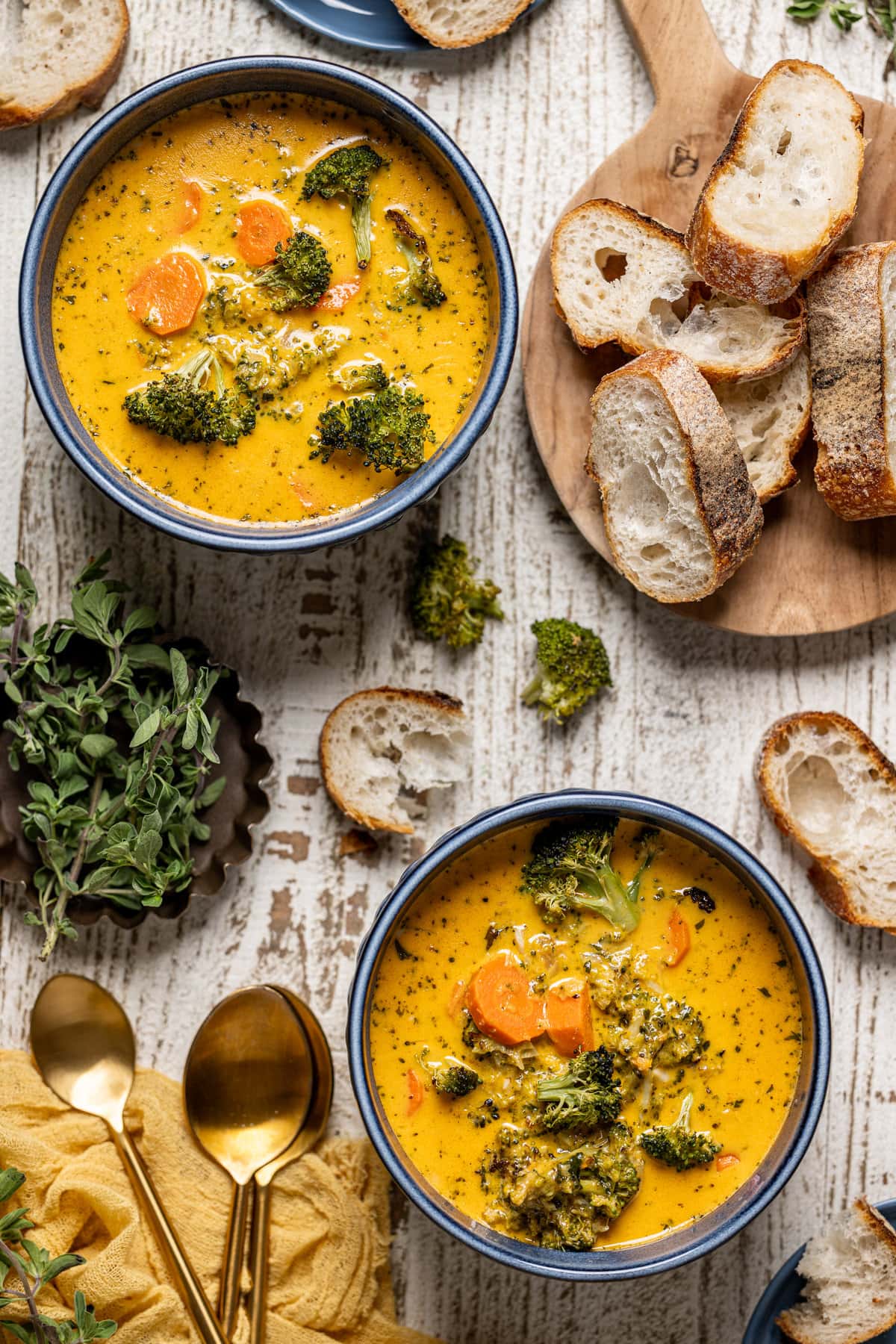 Overhead shot of two bowls of Roasted Broccoli Cheddar Soup