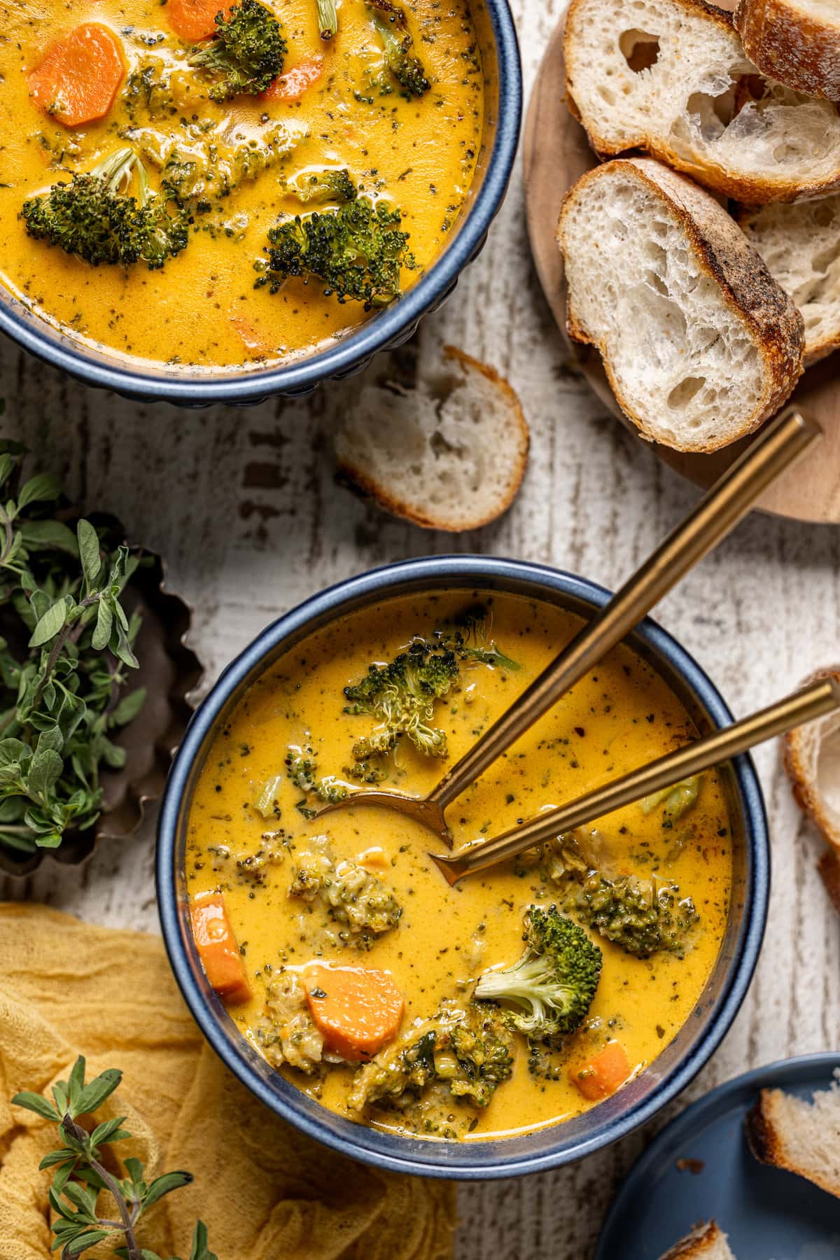 Bowl of Roasted Broccoli Cheddar Soup with two spoons