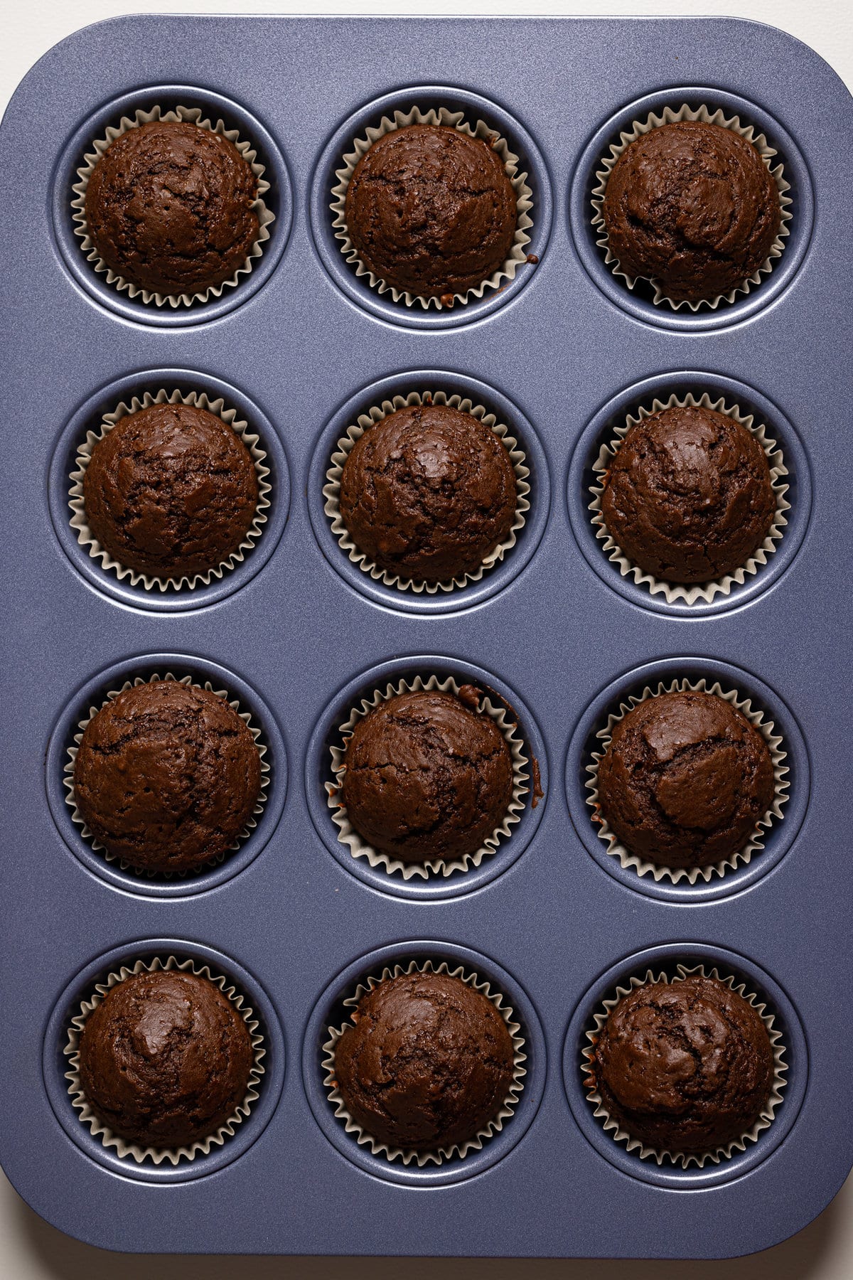 Muffin pan full of cooked Chocolate Sweet Potato Cupcakes