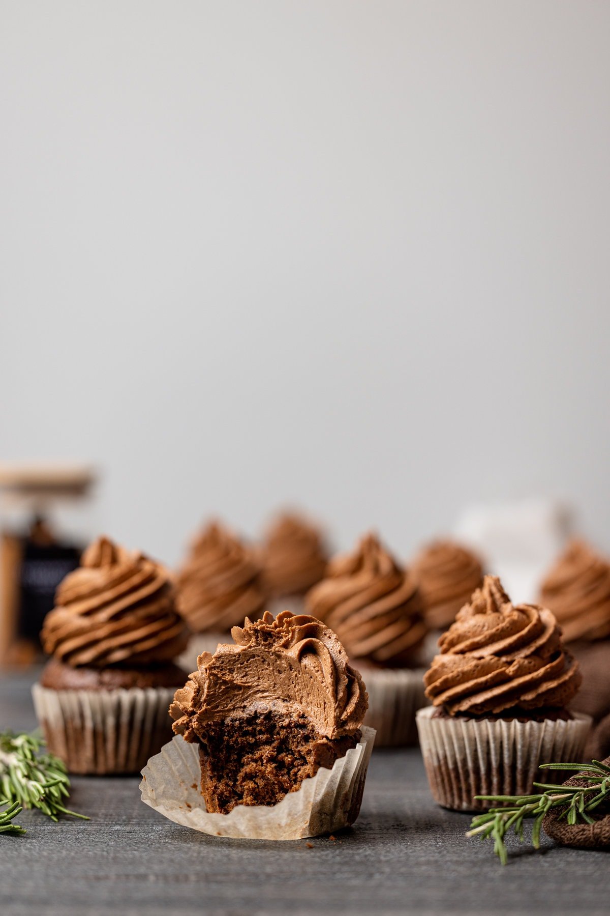 Group of Chocolate Sweet Potato Cupcakes, one of which is missing a bite