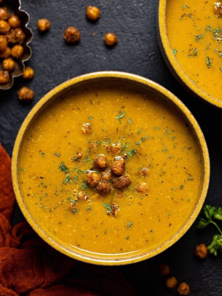 Bowls of Spicy Curry Pumpkin Soup with Chickpeas