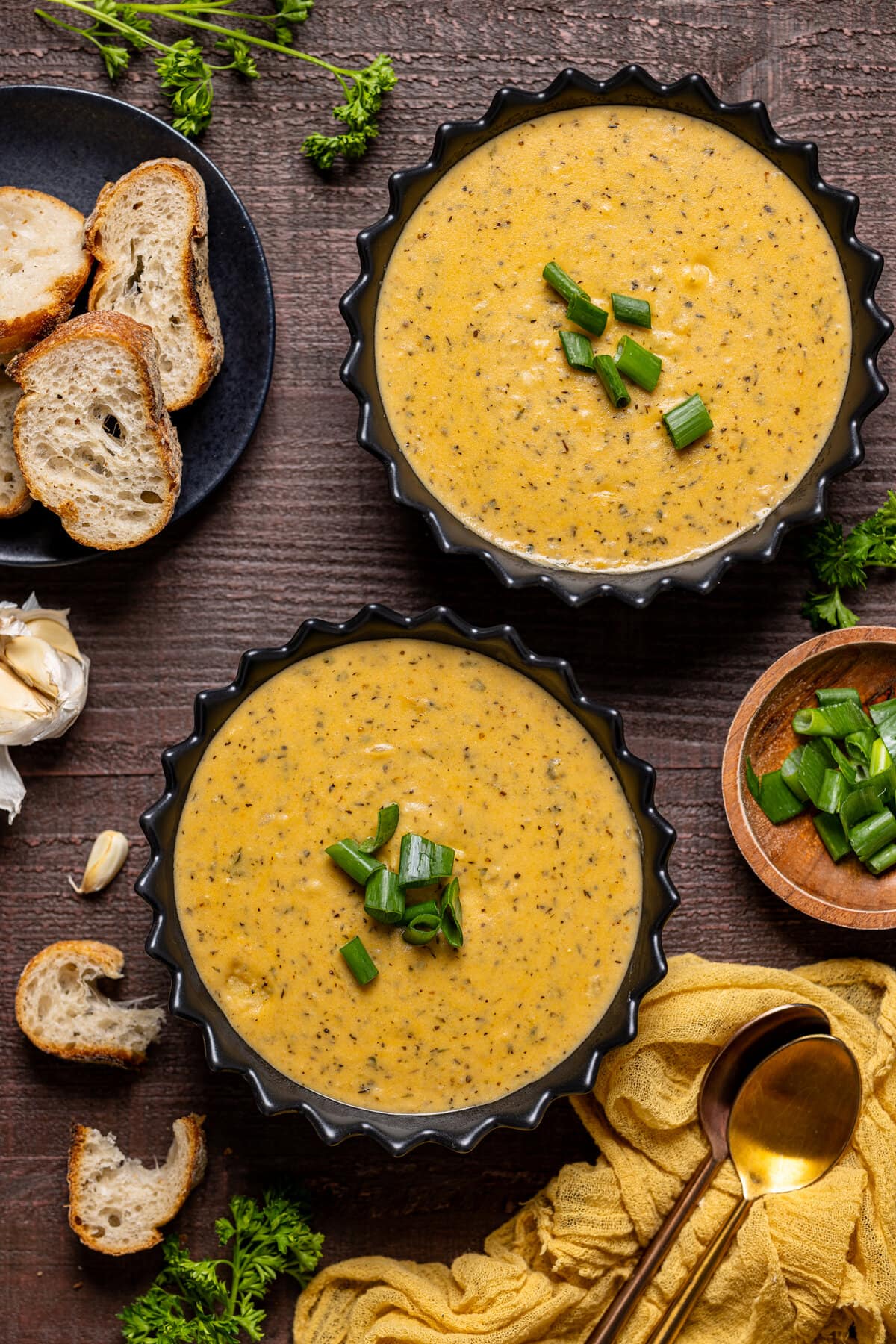 Two bowls of Cheddar Garlic Herb Potato Soup