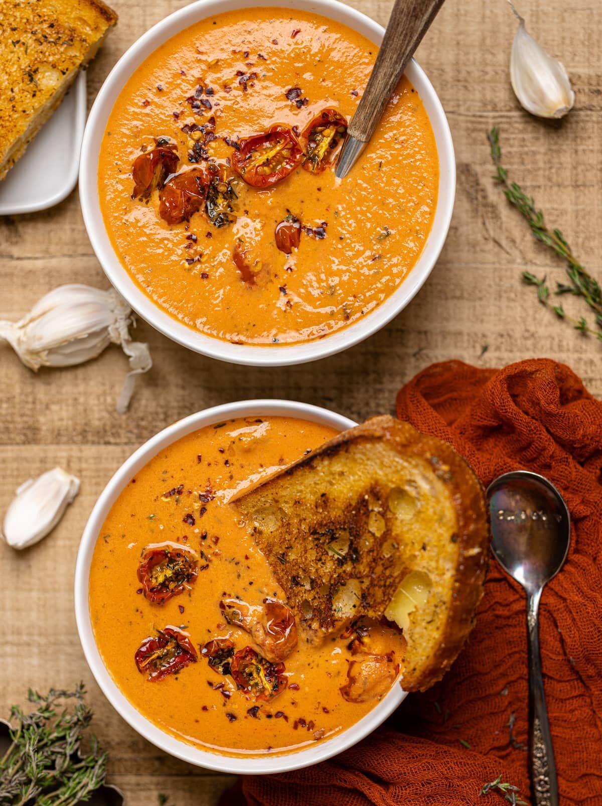 Two bowls of Creamy Roasted Garlic Tomato Soup