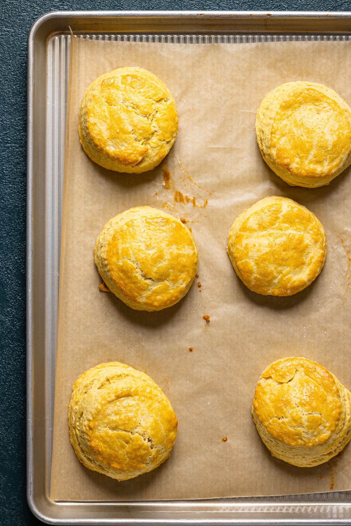 Cooked Flaky Sweet Potato Biscuits on a baking sheet