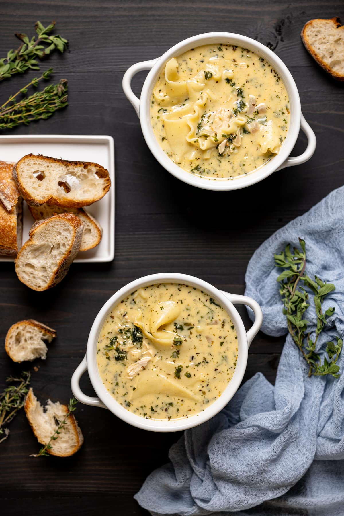 Overhead shot of two bowls of Creamy White Chicken Lasagna Soup