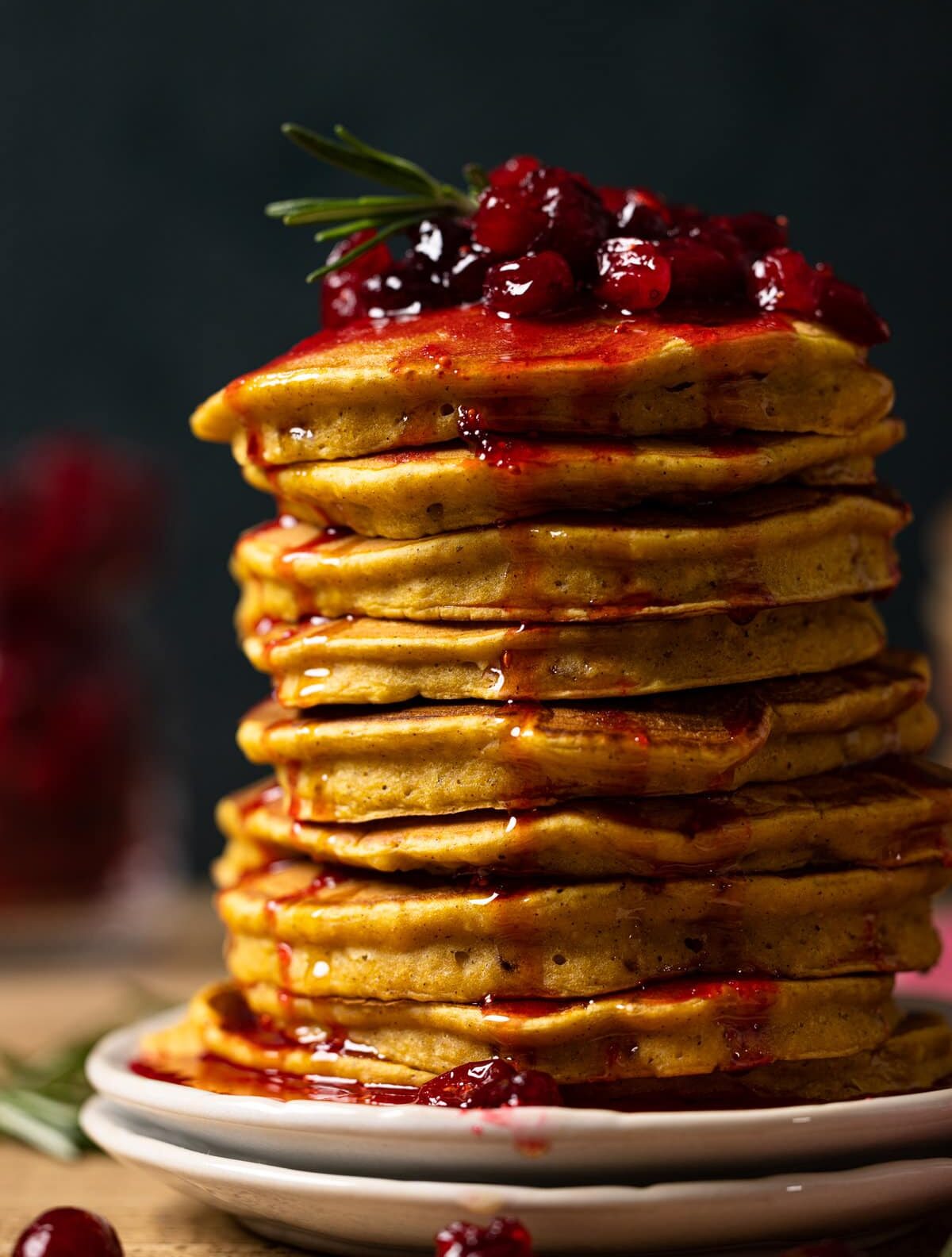 Closeup of a large stack of Apple Cider Pumpkin Pancakes with Cranberries