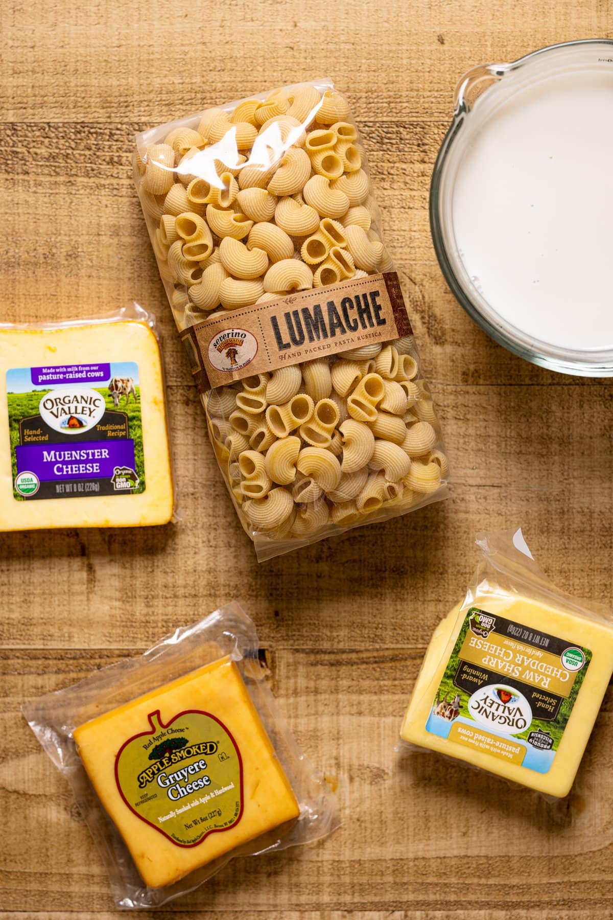 Ingredients for Creamy Stovetop Southern Mac and Cheese including muenster, cheddar, and gruyere cheeses