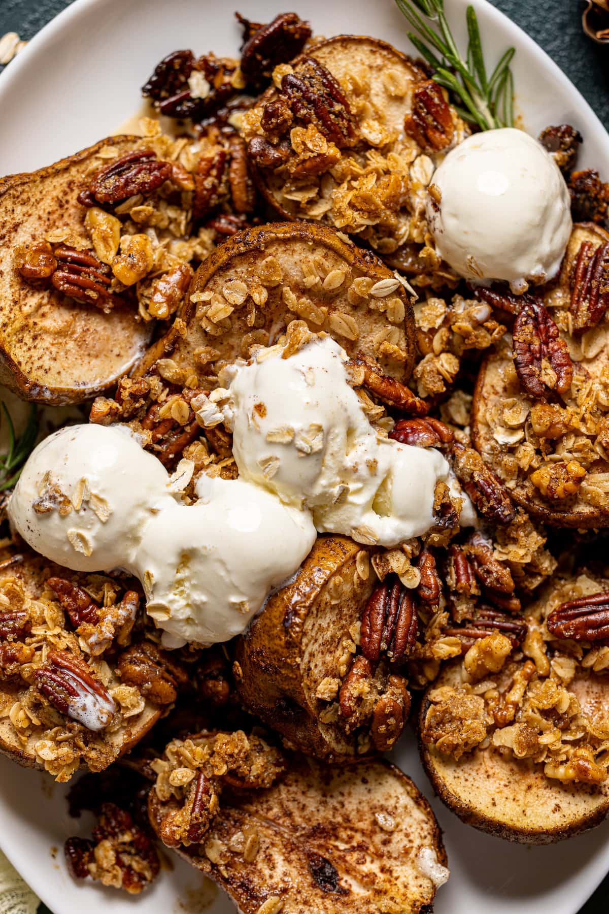 Maple Roasted Pear Crisp on a sheet pan topped with ice cream