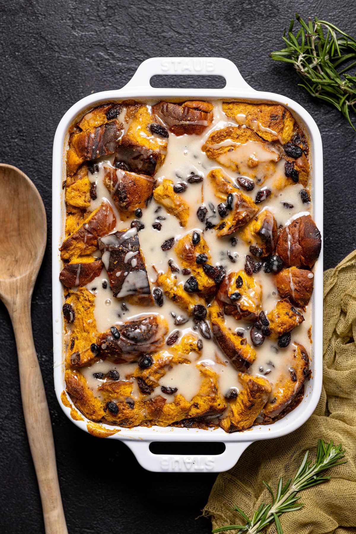 Pan of Vegan Sweet Potato Bread Pudding topped with a maple glaze