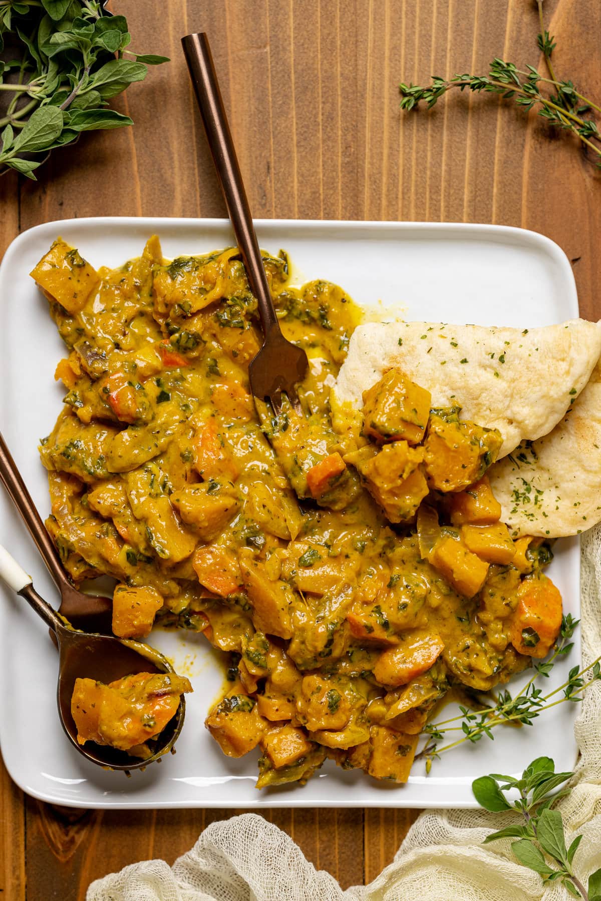 Plate of Vegan Pumpkin Curry Butternut Squash with silverware