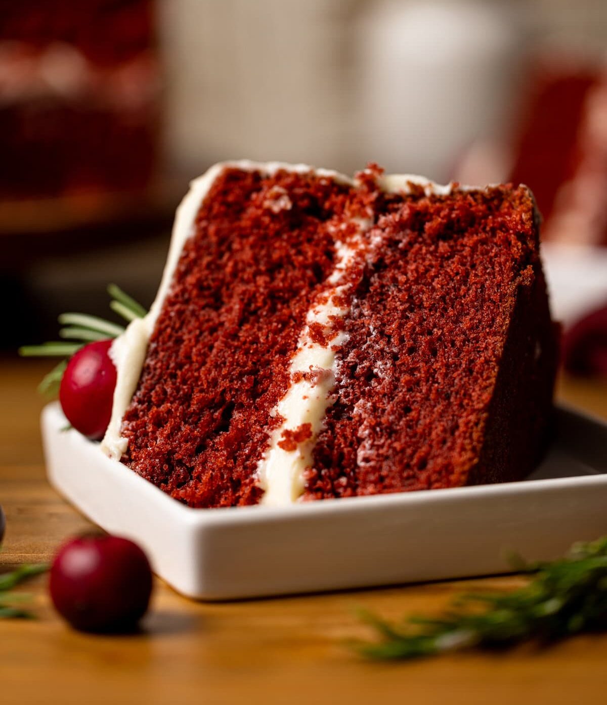 Slice of Red Velvet Cake with Cream Cheese Frosting on its side