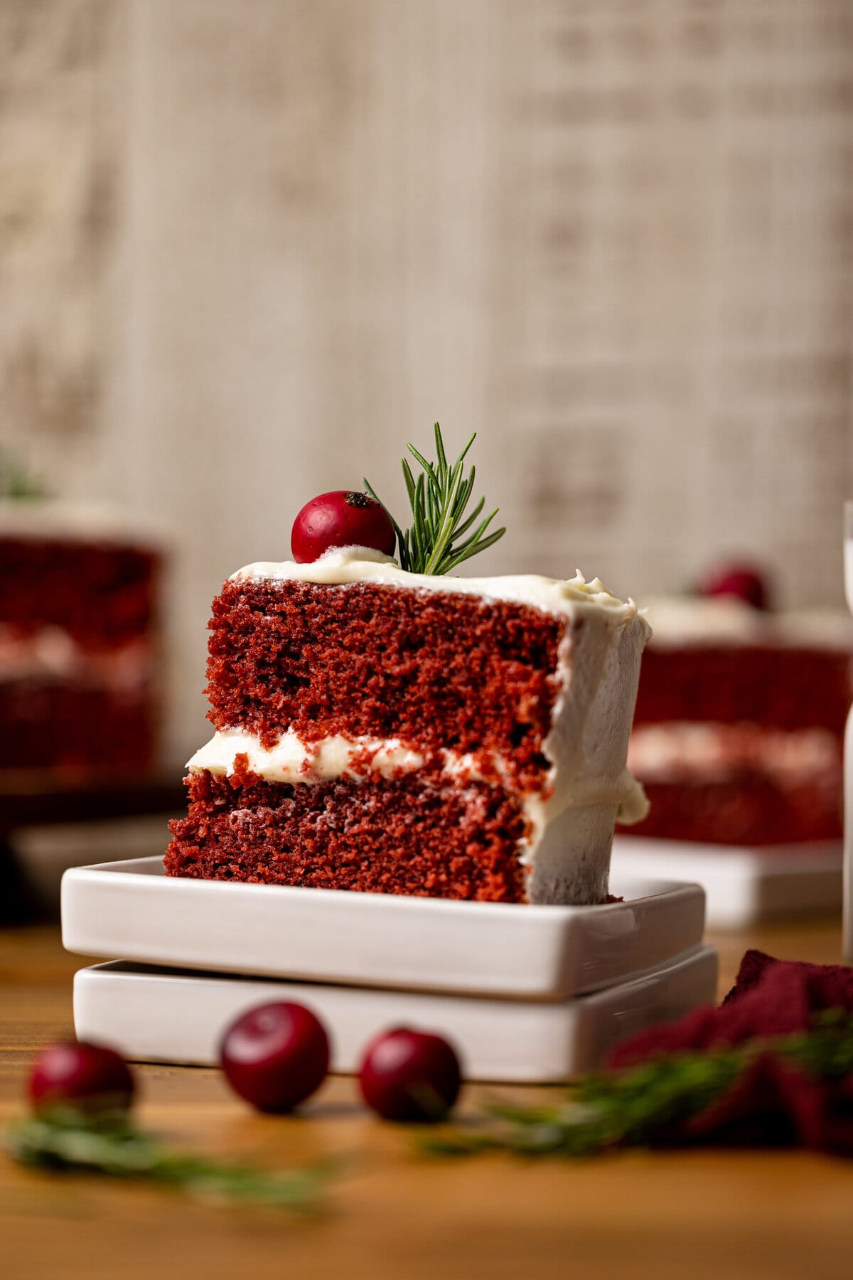 Slice of Red Velvet Cake with Cream Cheese Frosting on two plates